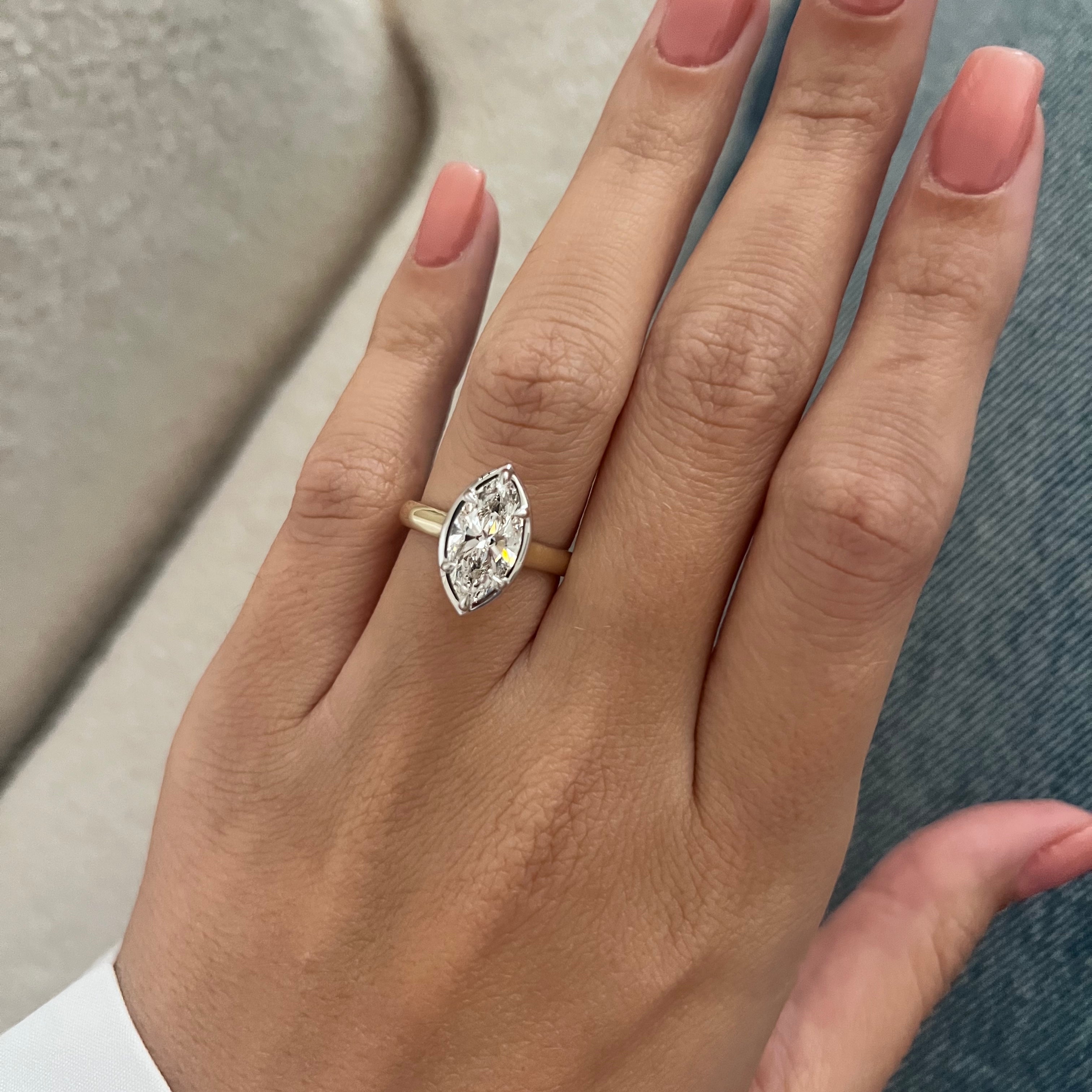 2 carat Oval cut lab-grown diamond IGI certified, bezel engagement ring.