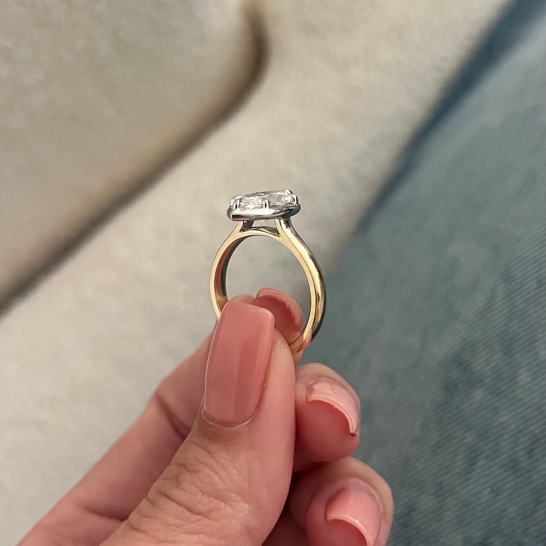 2 carat Oval cut lab-grown diamond IGI certified, bezel engagement ring.