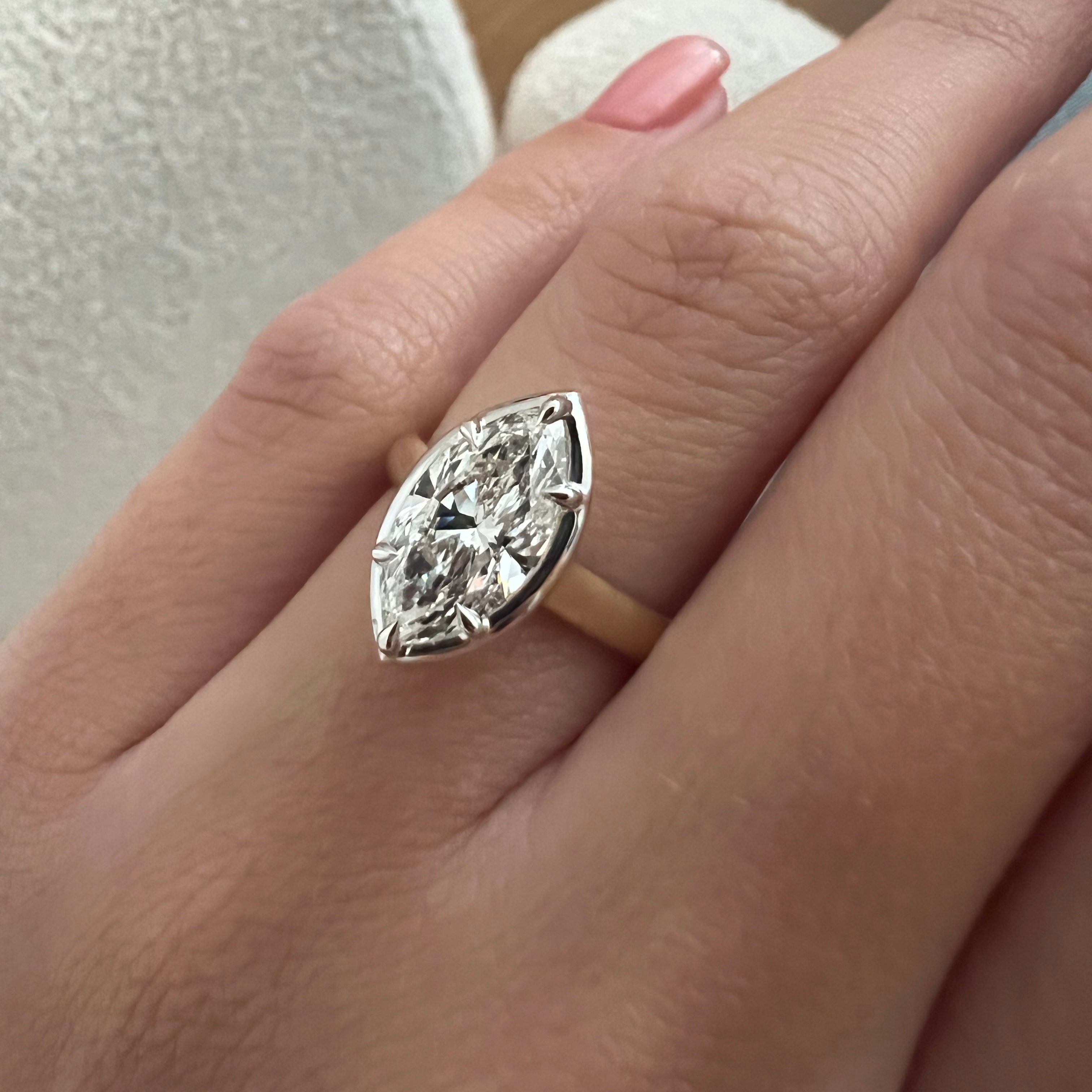 2 carat Oval cut lab-grown diamond IGI certified, bezel engagement ring.
