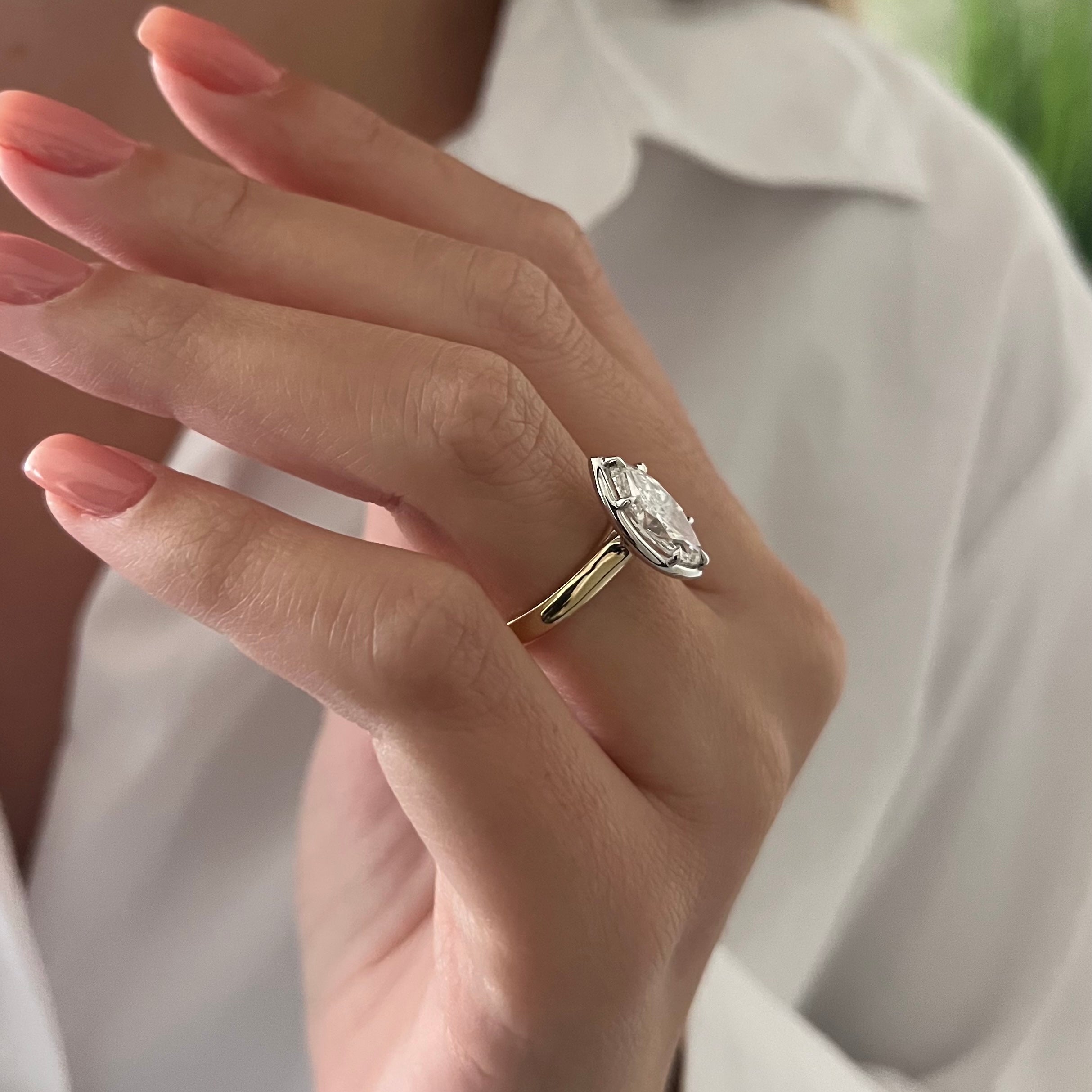 2 carat Oval cut lab-grown diamond IGI certified, bezel engagement ring.
