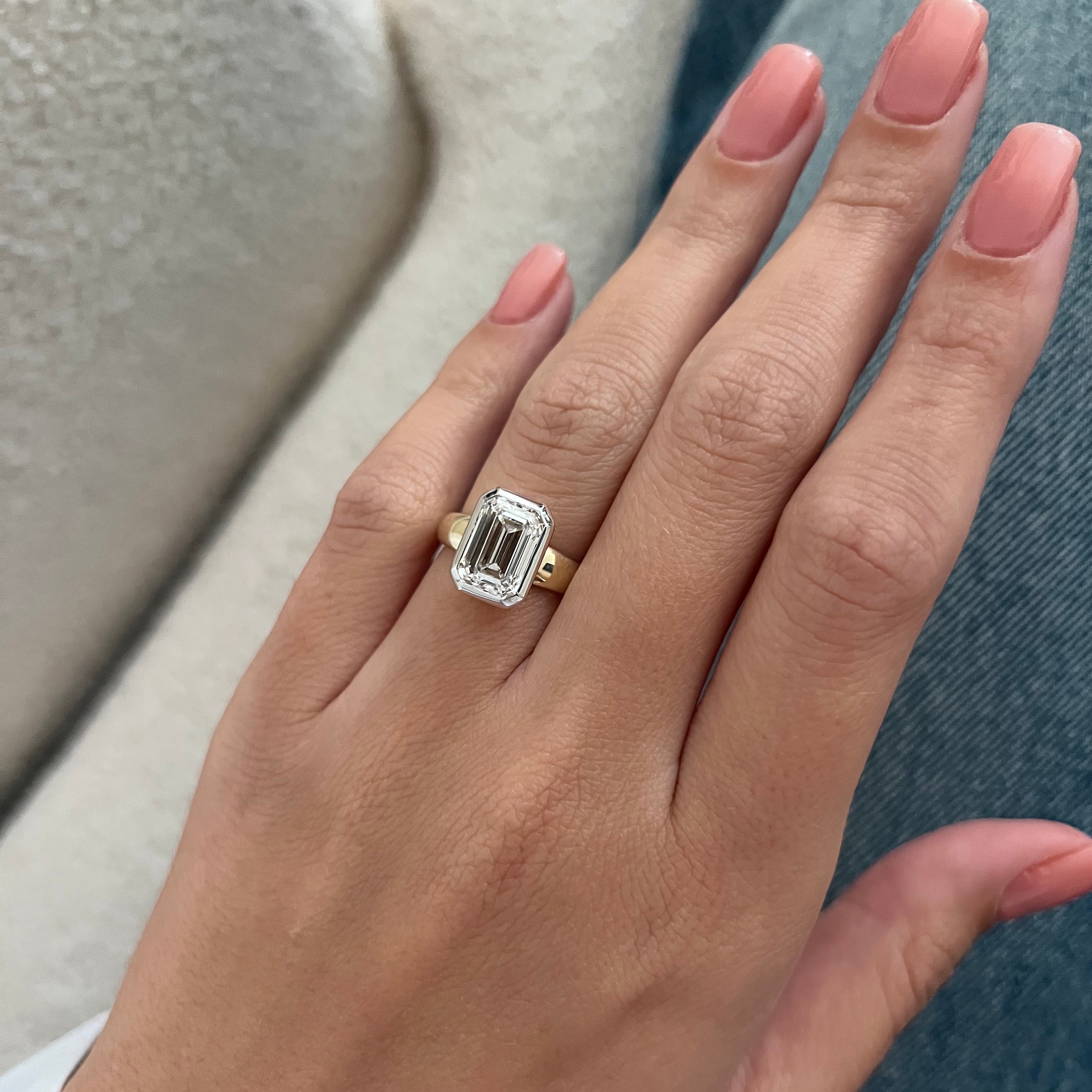 3 carat Oval cut lab-grown diamond IGI certified, bezel engagement ring.