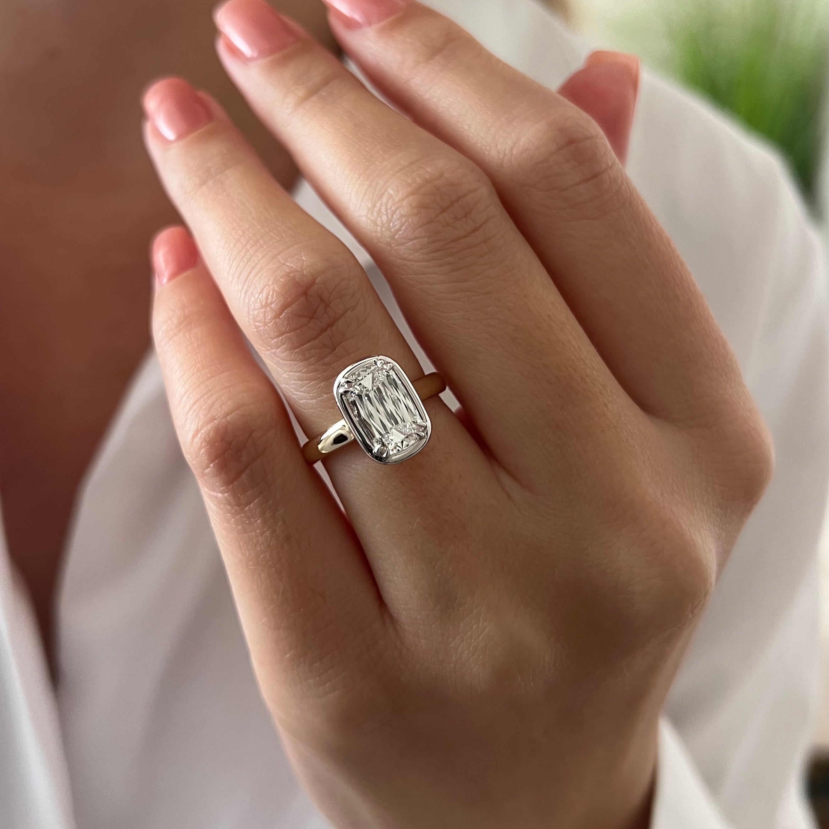 2 carat Oval cut lab-grown diamond IGI certified, bezel engagement ring.
