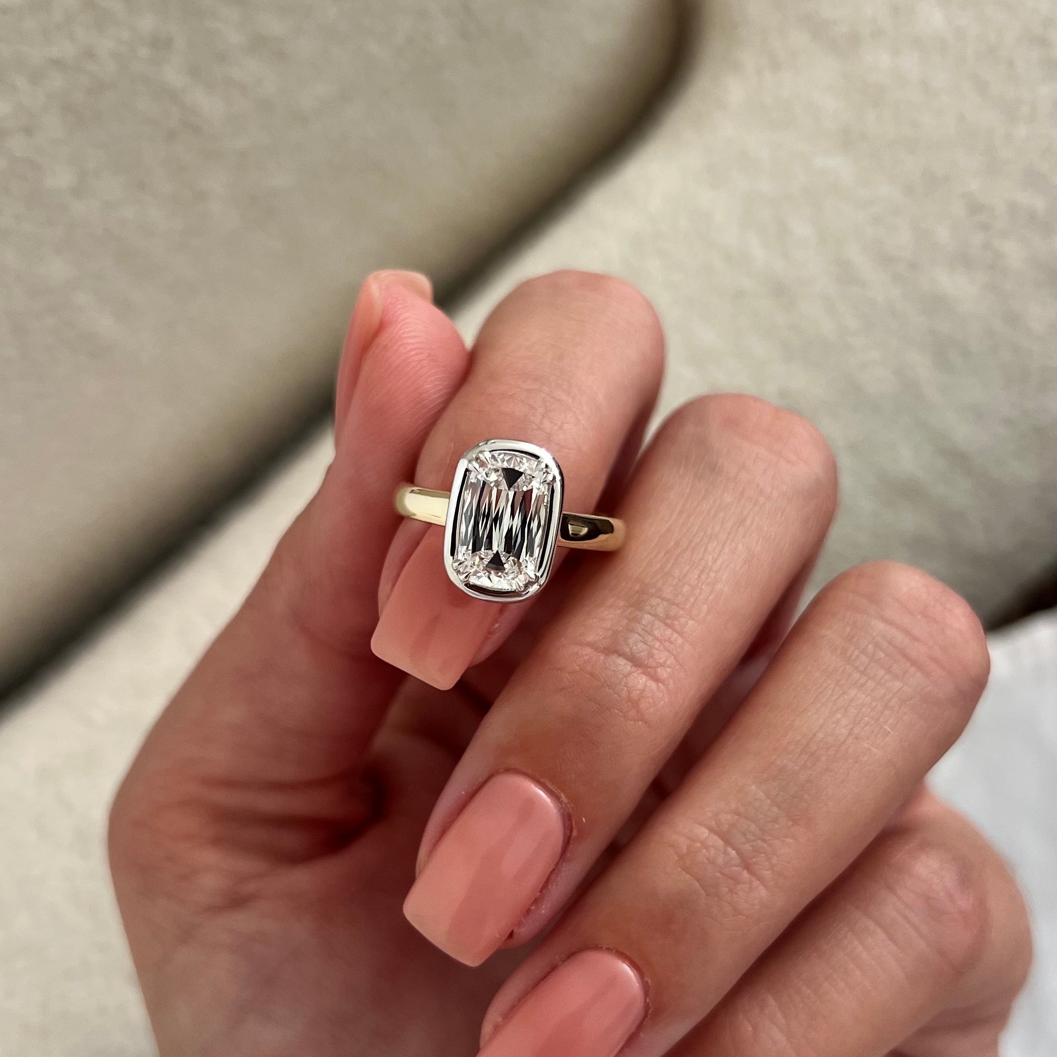 2 carat Oval cut lab-grown diamond IGI certified, bezel engagement ring.