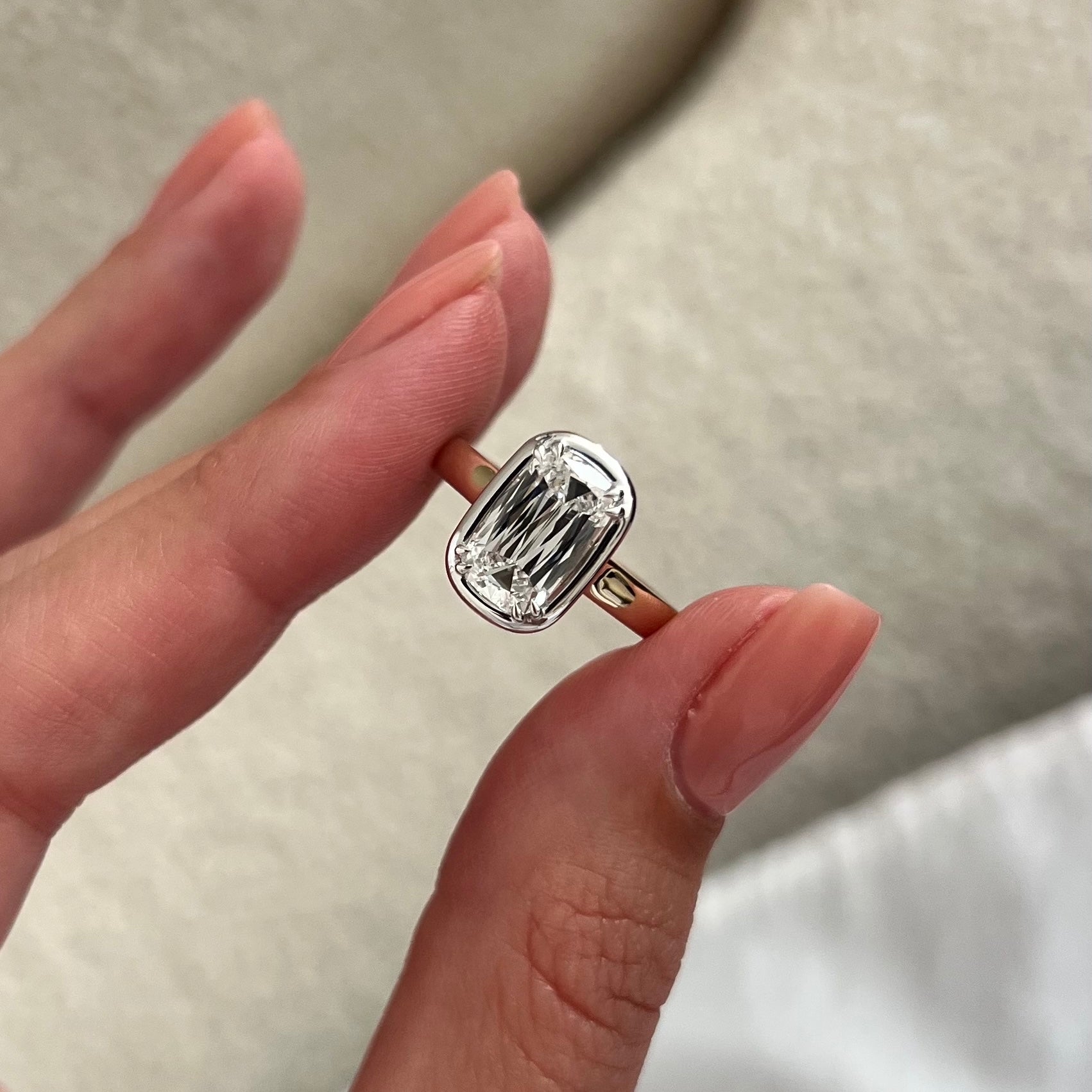 2 carat Oval cut lab-grown diamond IGI certified, bezel engagement ring.
