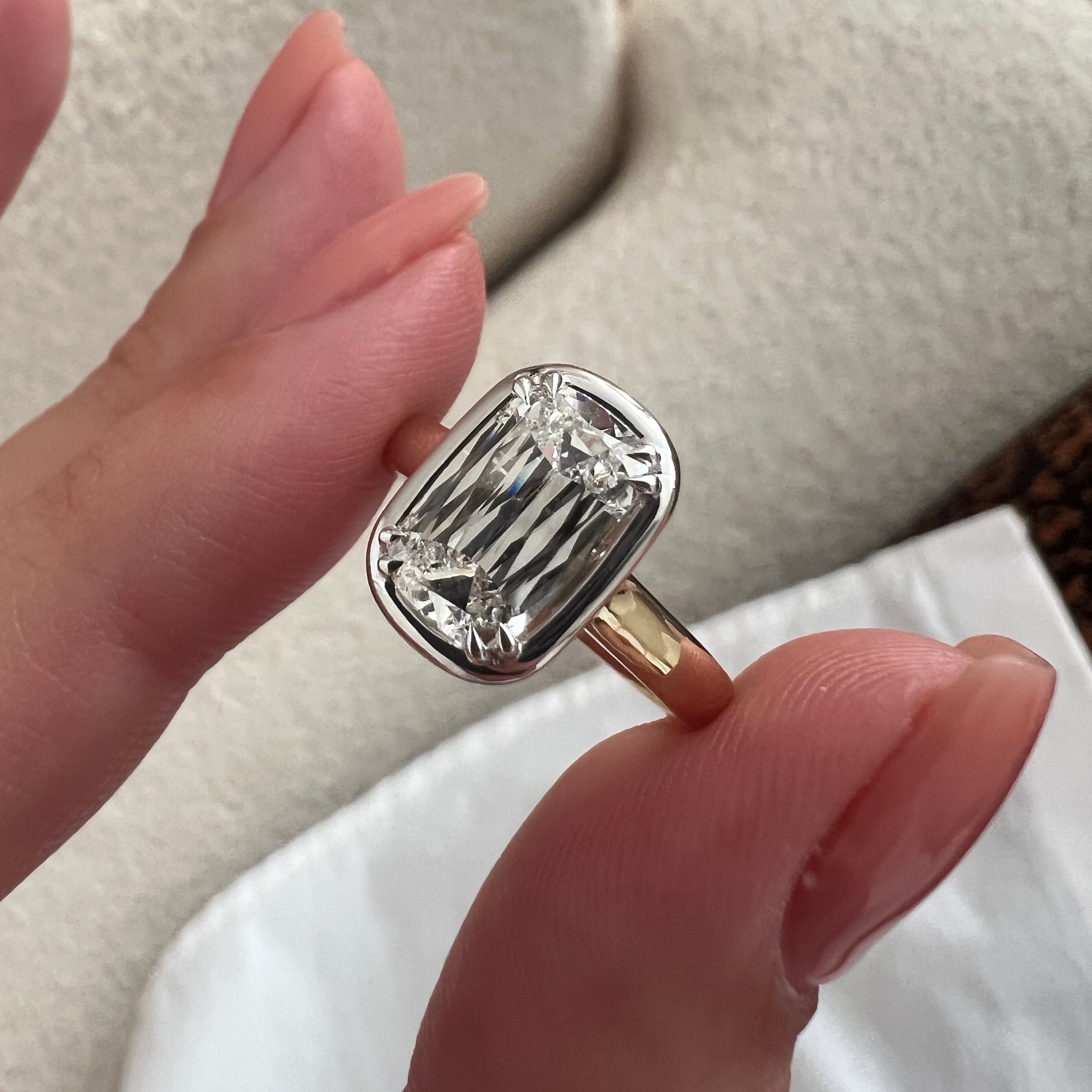 2 carat Oval cut lab-grown diamond IGI certified, bezel engagement ring.