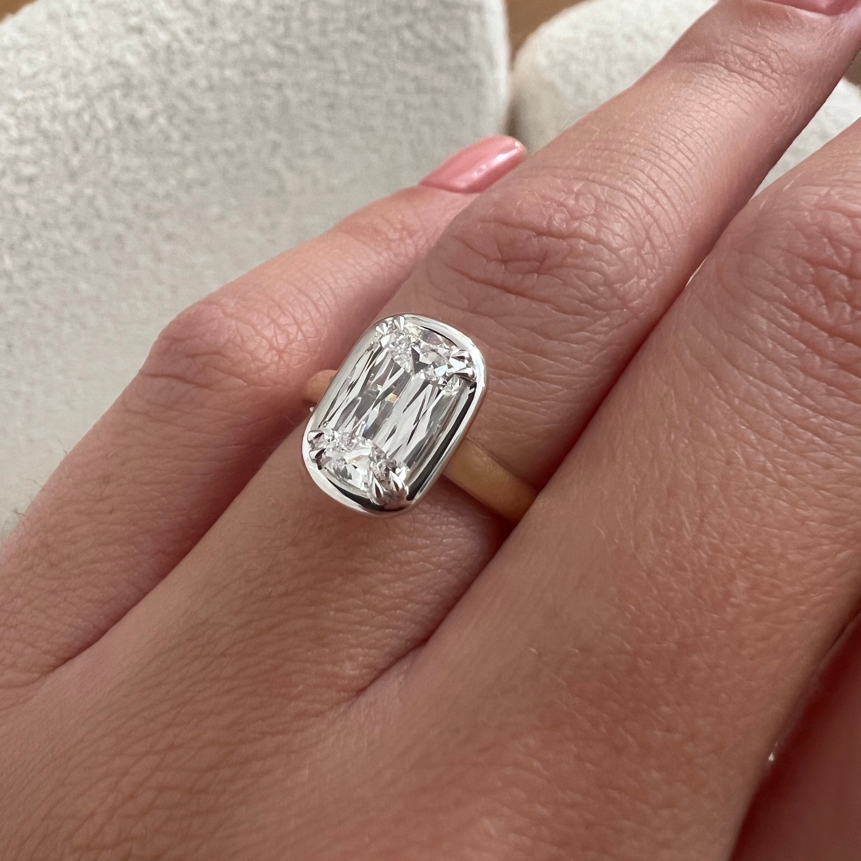 2 carat Oval cut lab-grown diamond IGI certified, bezel engagement ring.