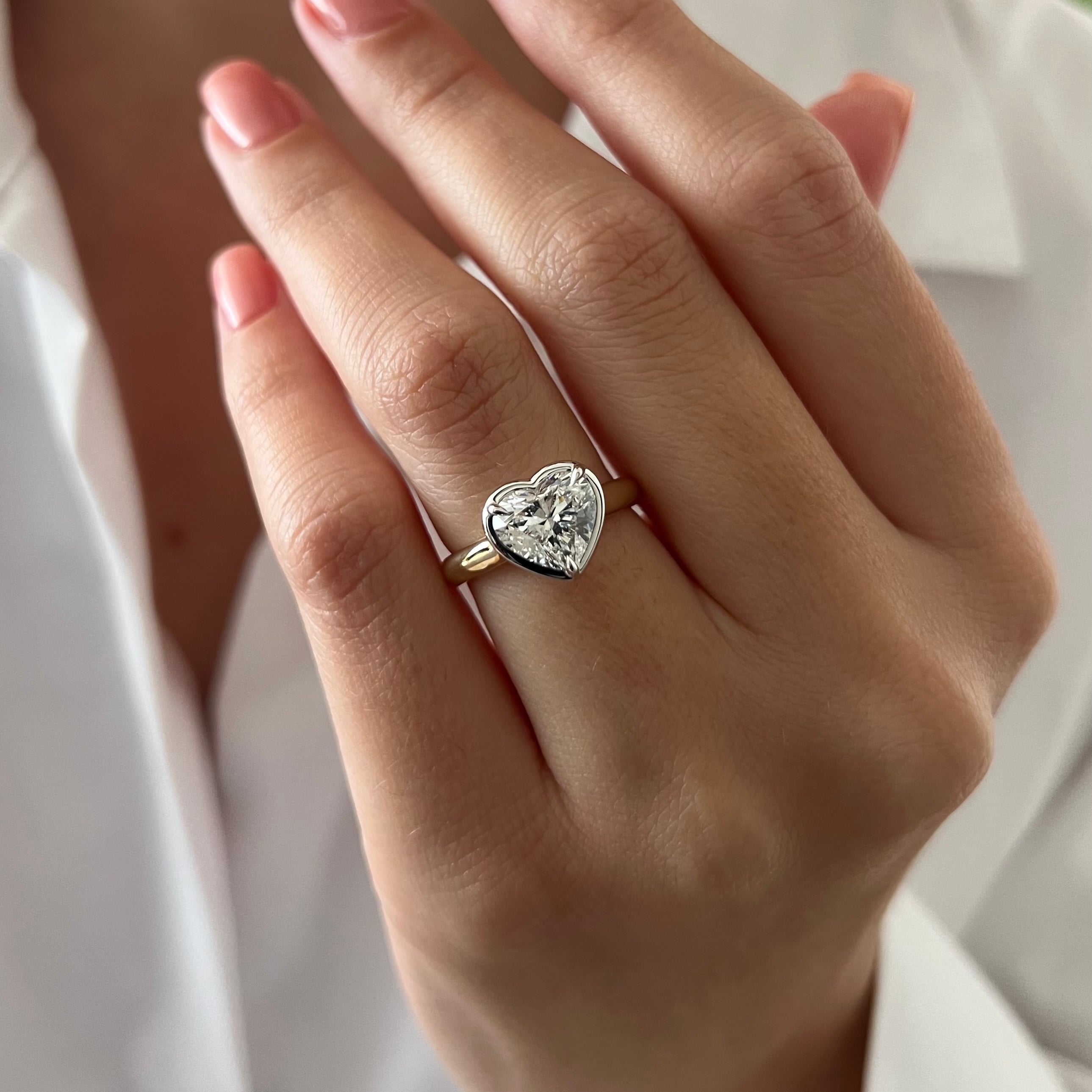 2 carat Oval cut lab-grown diamond IGI certified, bezel engagement ring.