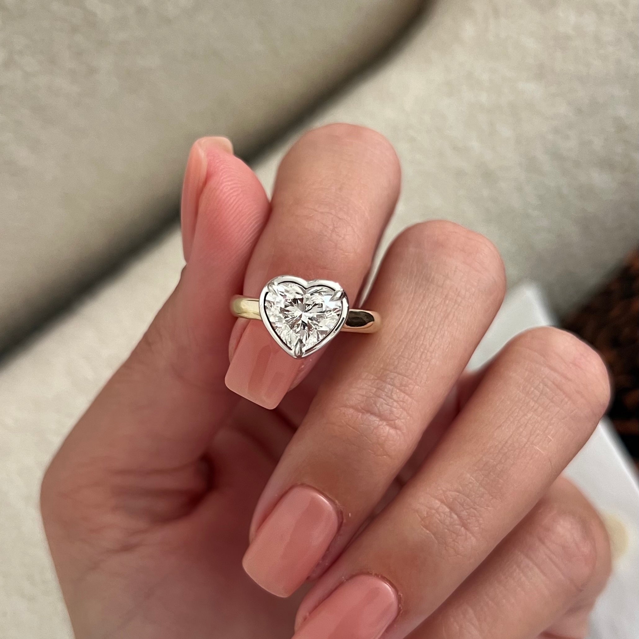 2 carat Oval cut lab-grown diamond IGI certified, bezel engagement ring.