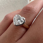2 carat Oval cut lab-grown diamond IGI certified, bezel engagement ring.