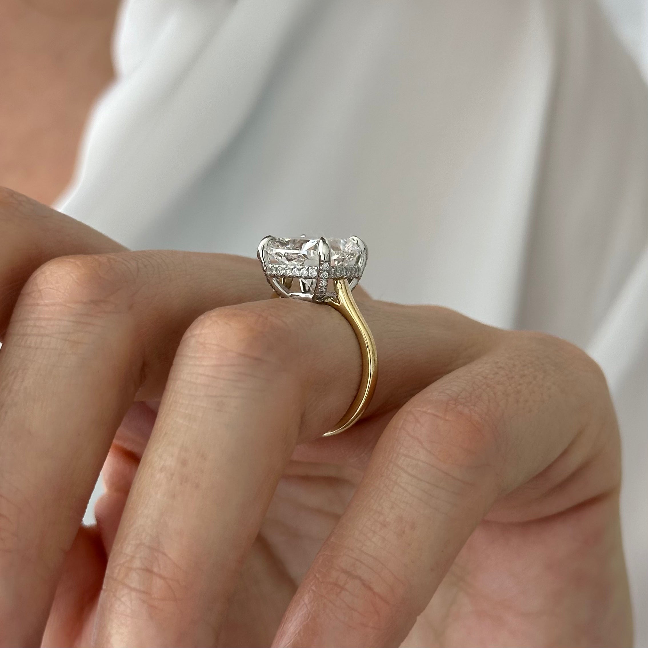 6 carat Cushion cut lab-grown diamond IGI certified, hidden halo engagement ring.