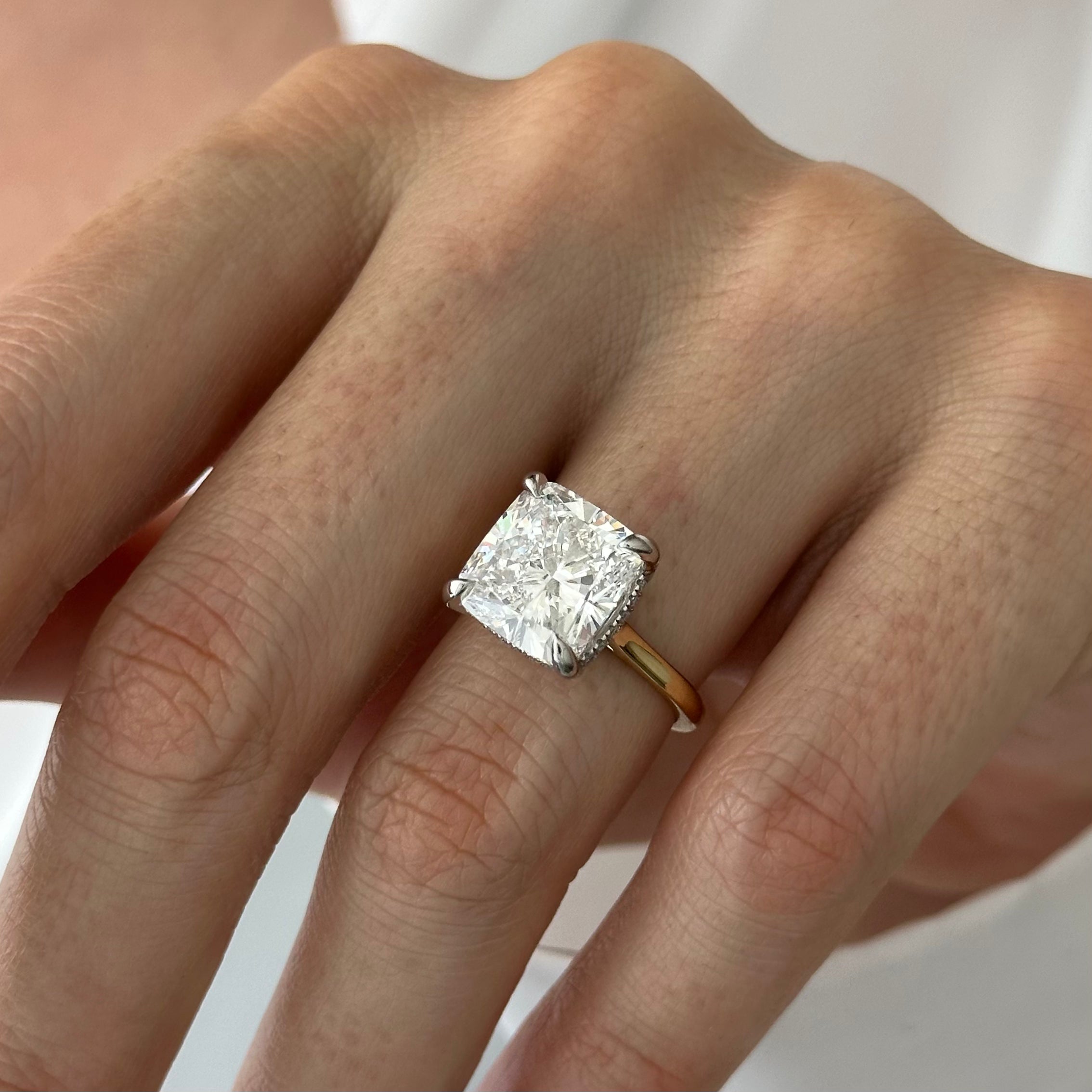 6 carat Cushion cut lab-grown diamond IGI certified, hidden halo engagement ring.