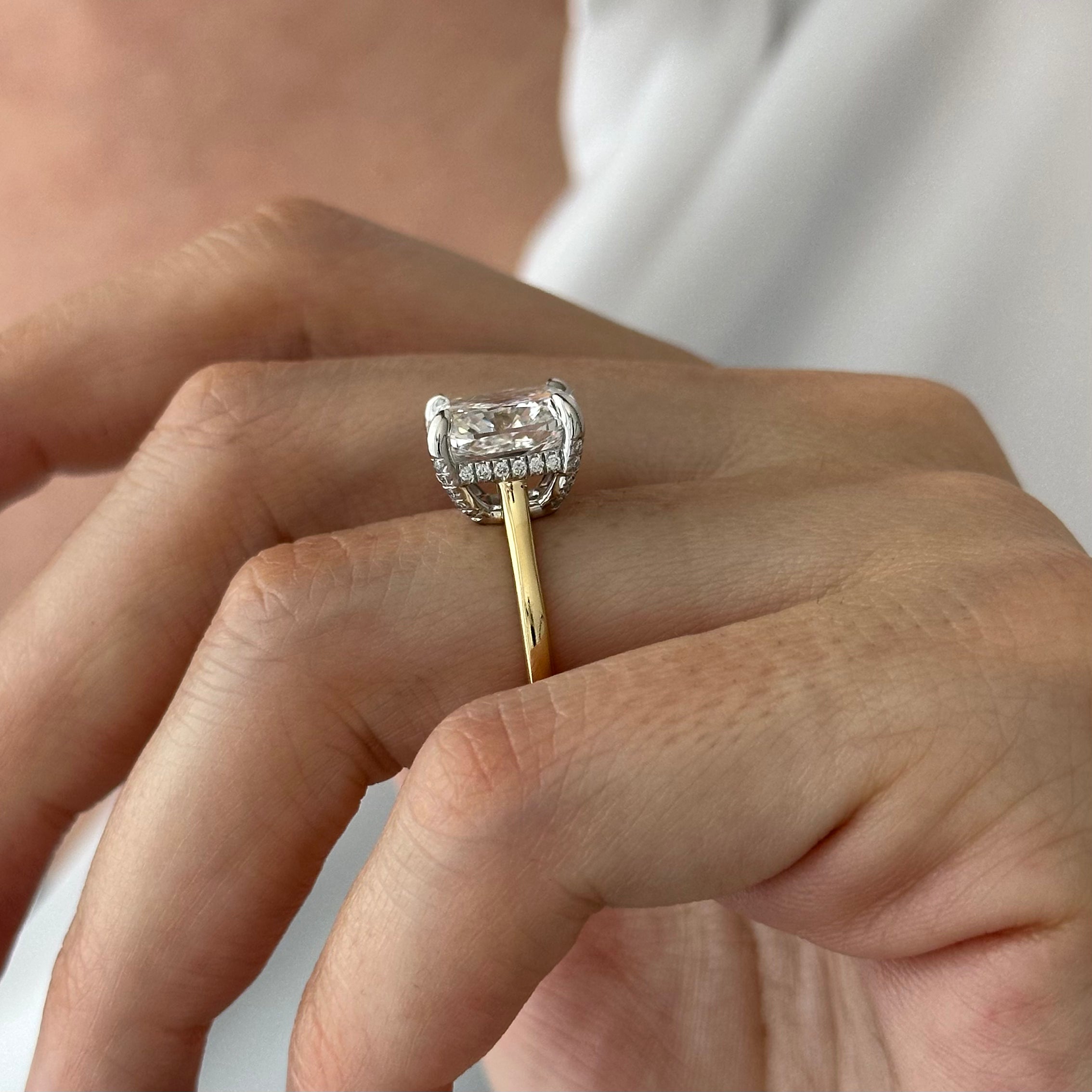 6 carat Cushion cut lab-grown diamond IGI certified, hidden halo engagement ring.