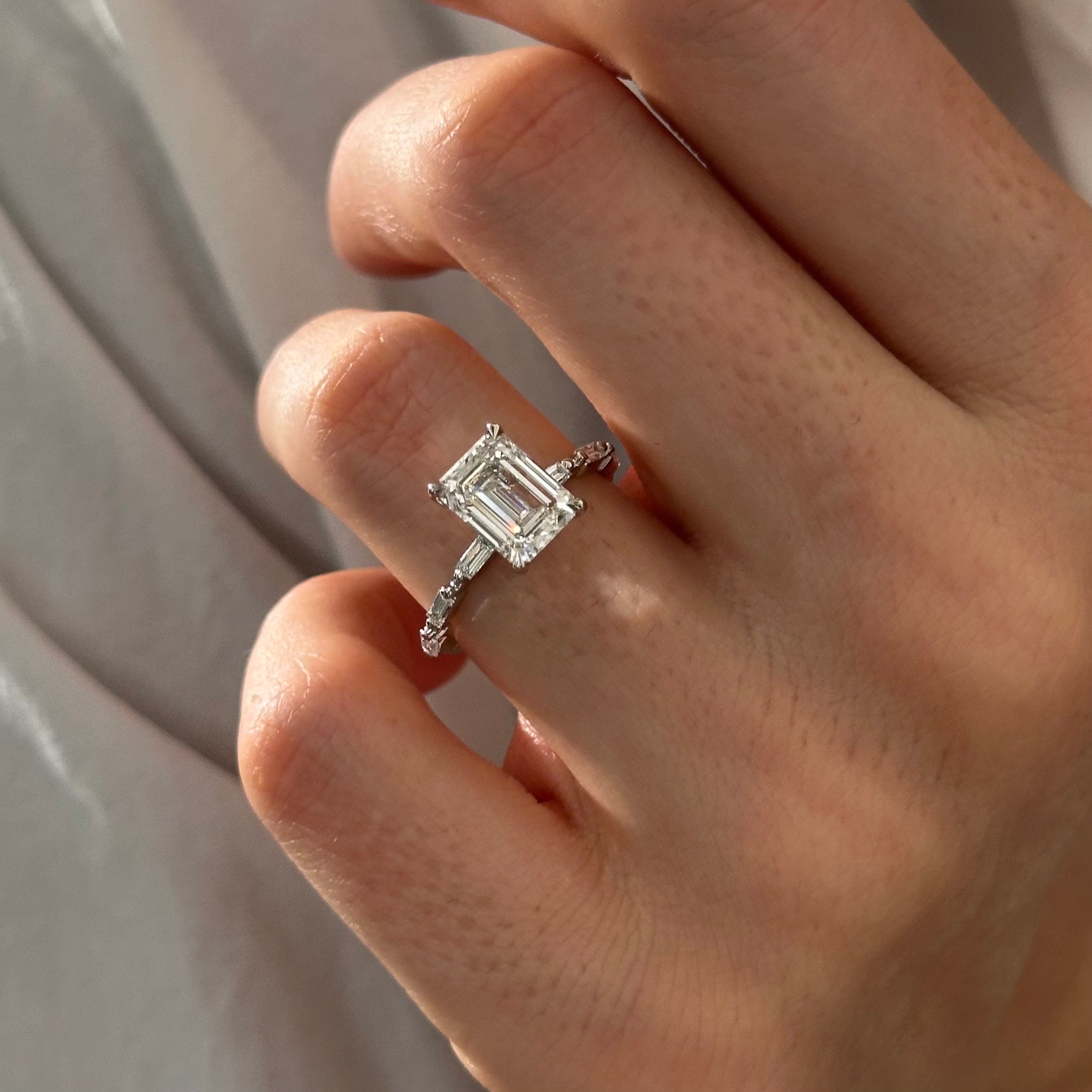 all-groups | 2.5 carat Emerald cut lab-grown diamond IGI certified, side stones engagement ring.
