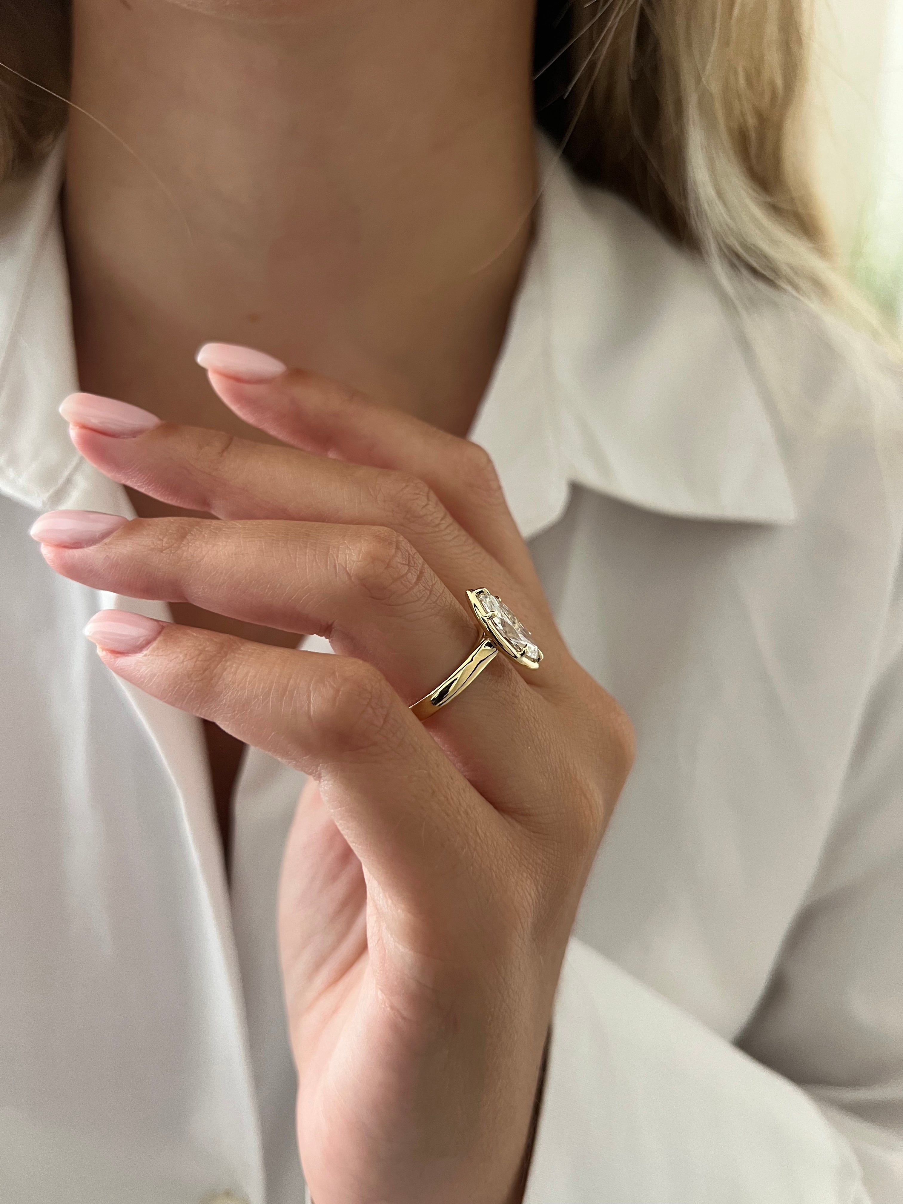 2 carat Oval cut lab-grown diamond IGI certified, bezel engagement ring.