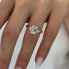 all-groups | 2.25 carat Emerald cut lab-grown diamond IGI certified, three stone engagement ring.