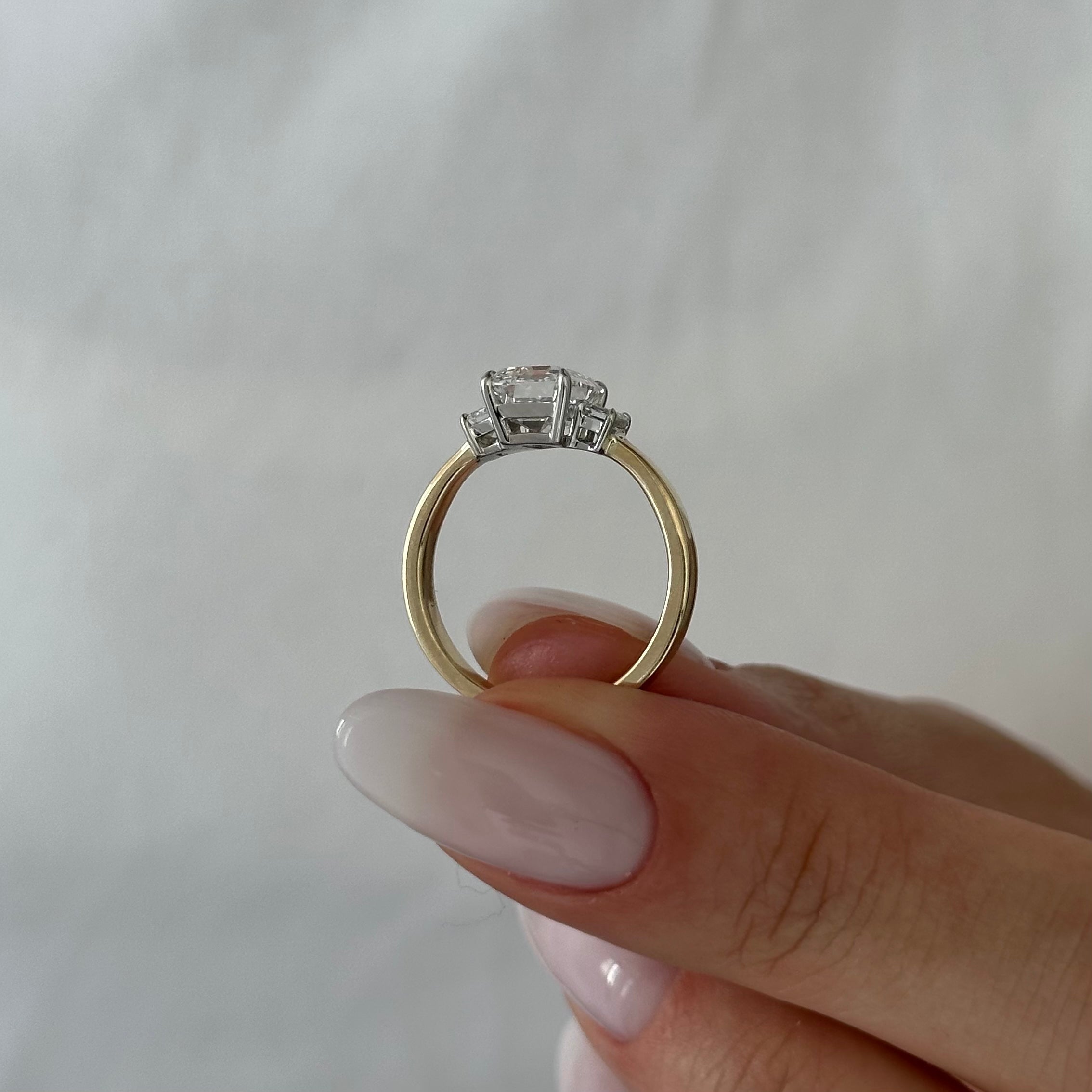 all-groups | 2.25 carat Emerald cut lab-grown diamond IGI certified, three stone engagement ring.