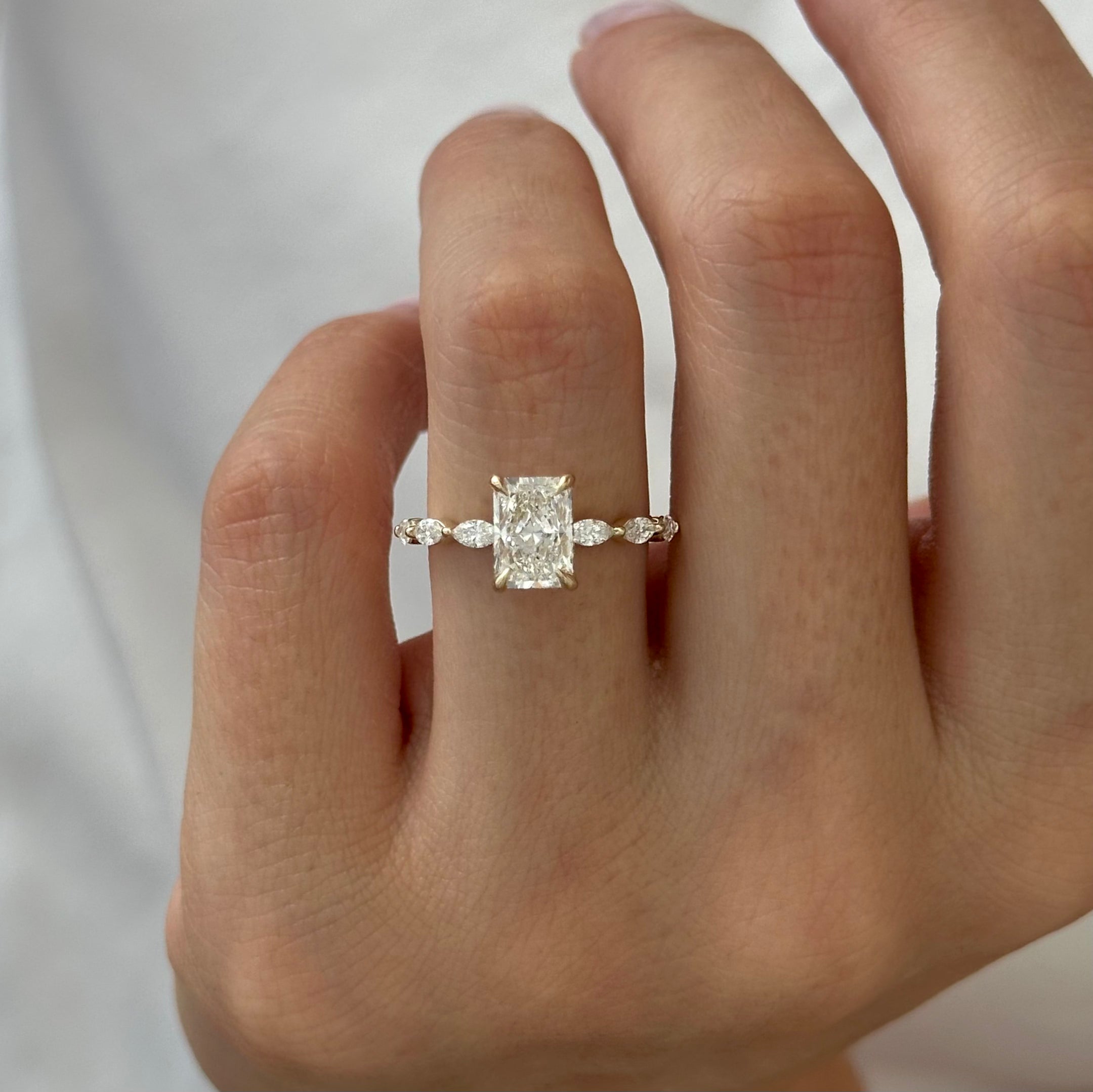 2.5 carat Emerald cut lab-grown diamond IGI certified, hidden halo engagement ring.