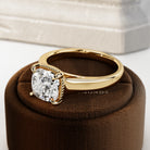 2 carat Cushion cut lab-grown diamond IGI certified, bezel engagement ring.
