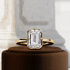 2 carat Elongated Cushion cut lab-grown diamond IGI certified, bezel engagement ring in 14K Yellow Gold.